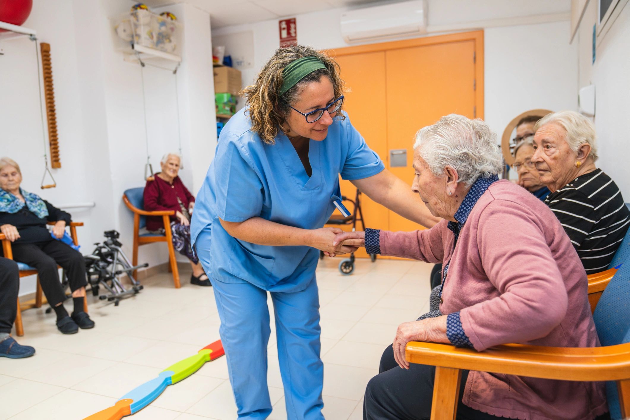 caring nurse helping elderly