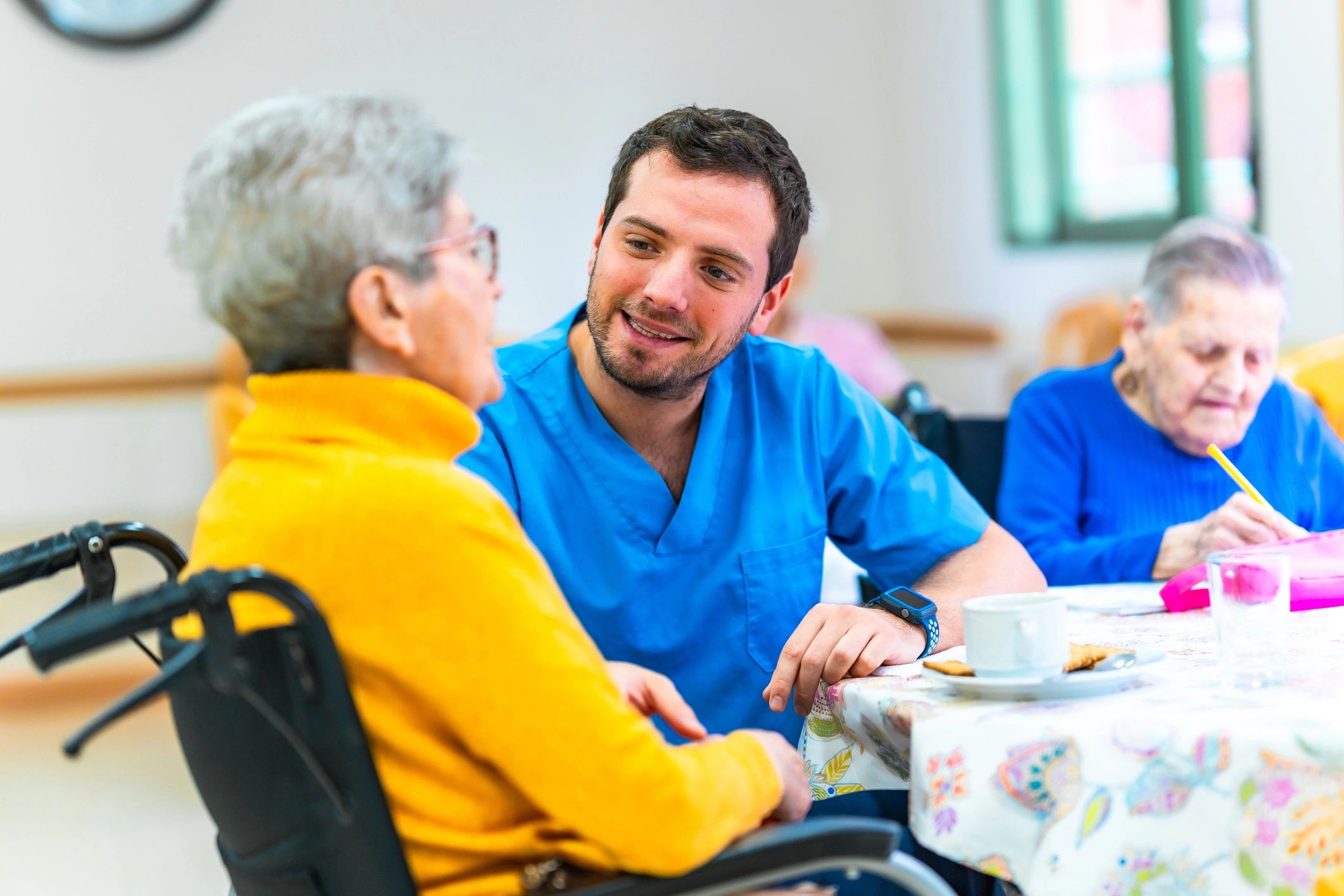 caring nurse helping elderly