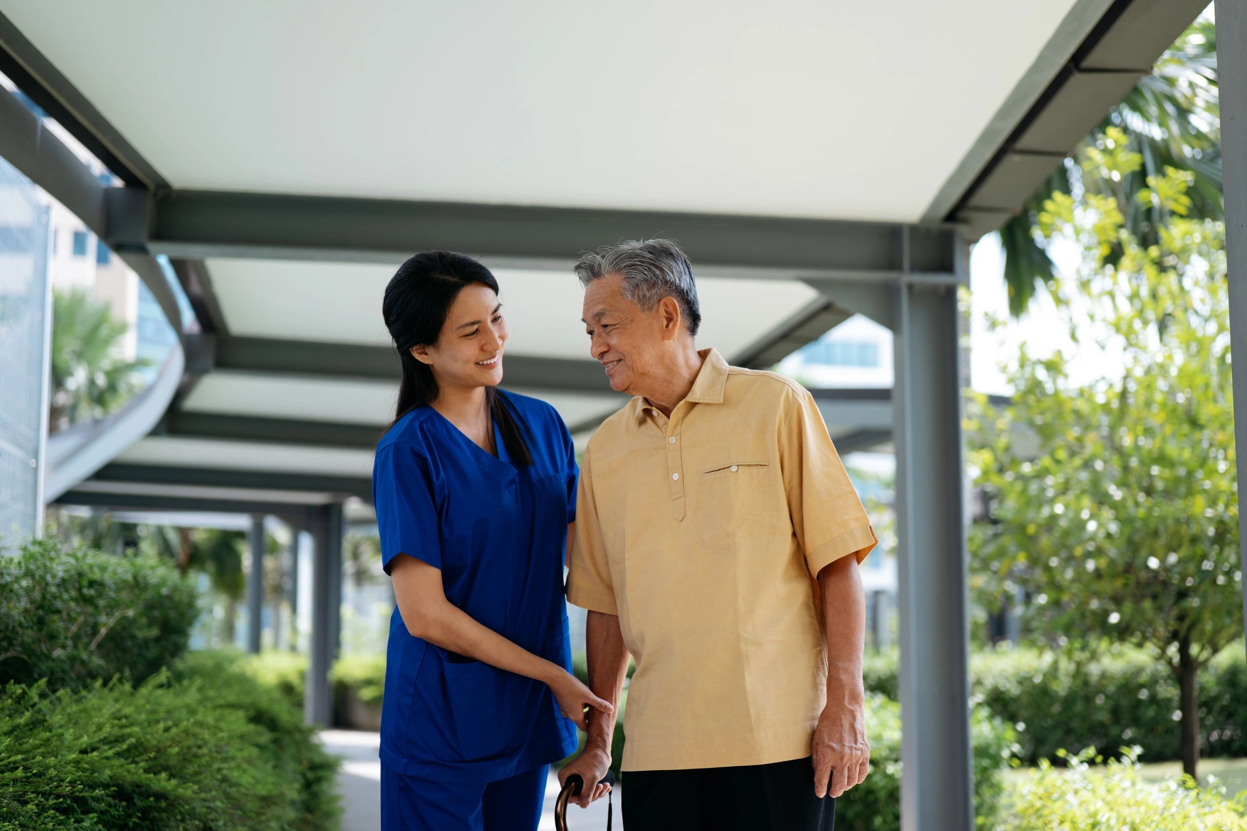 caring nurse helping elderly