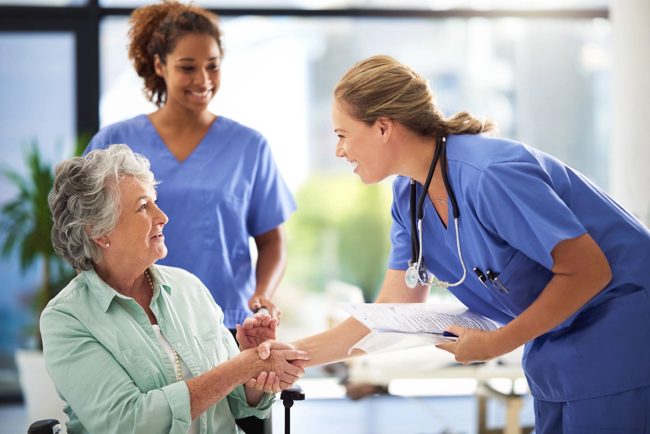 caring nurse helping elderly